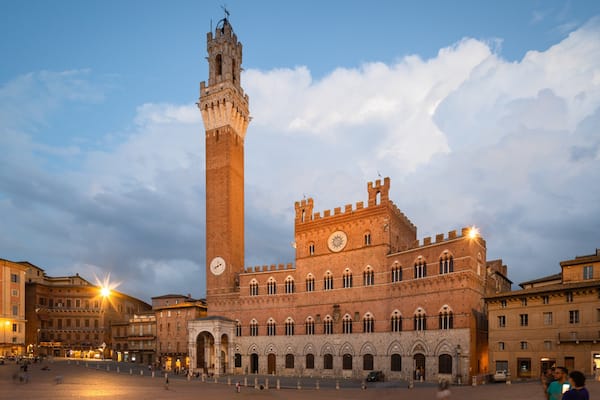 Palazzo Pubblico featuring a city, heritage architecture and night scenes