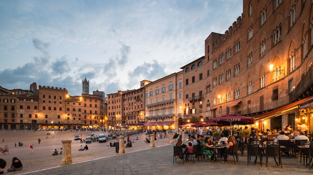 Piazza del Campo which includes a sunset, a square or plaza and a city