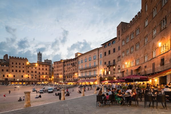 Piazza del Campo which includes a sunset, a square or plaza and a city