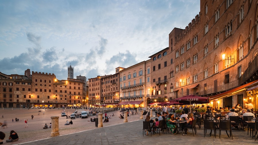 Piazza del Campo which includes a sunset, a square or plaza and a city