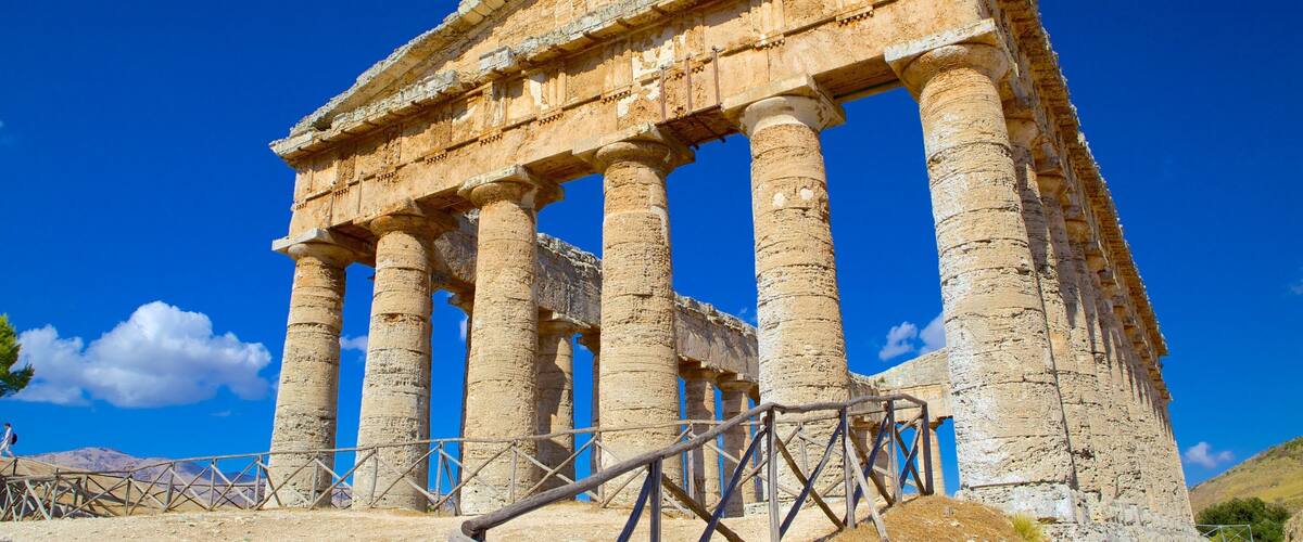An ancient Greek temple with large columns and a pediment.