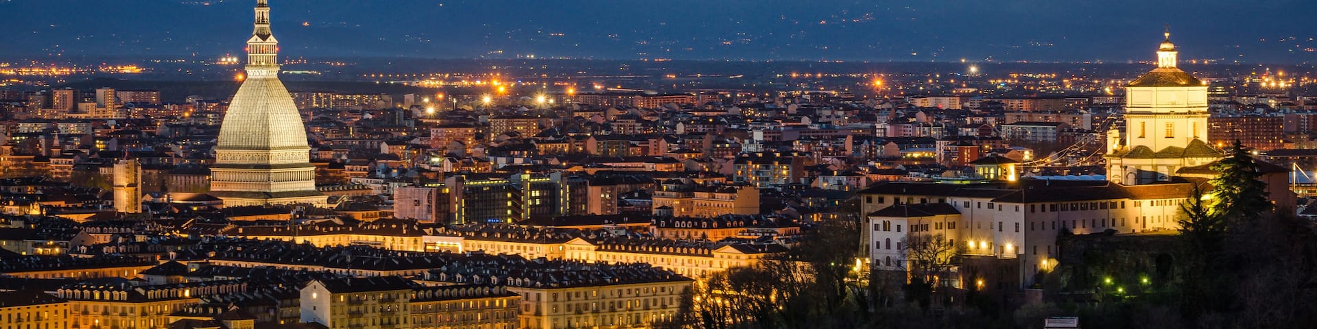 Turin (Torino), night panorama with Mole Antonelliana and Alps