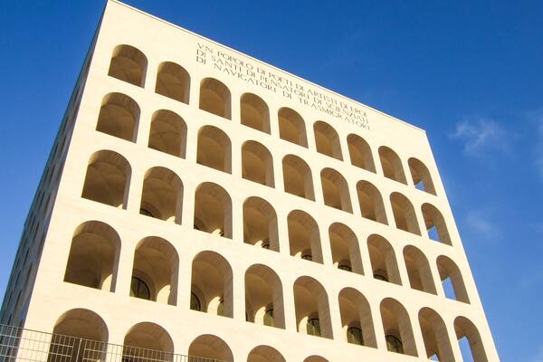 Palazzo della Civilta Italiana (Square Colosseum) in Rome, Italy. The inscription reads: "A nation of poets, of artists, of heroes, of saints, of thinkers, of scientists, of navigators, of migrants";