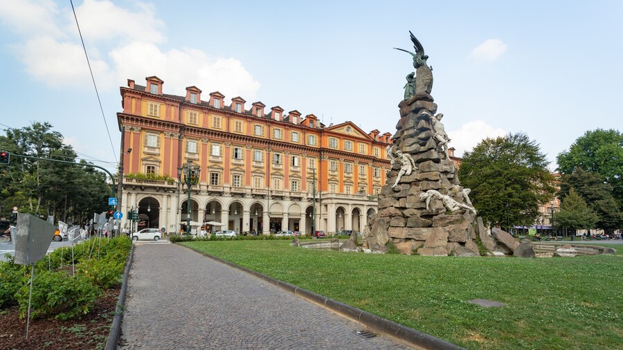 Piazza Statuto which includes a fountain, outdoor art and a garden