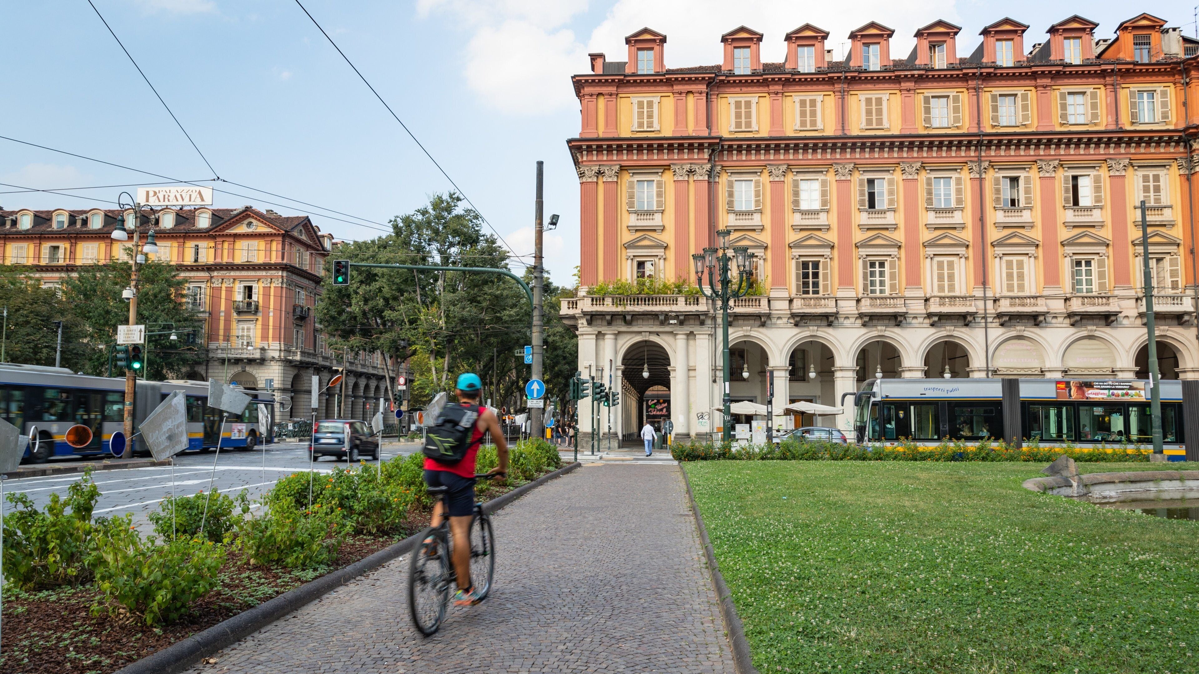 Piazza Statuto showing cycling as well as an individual male