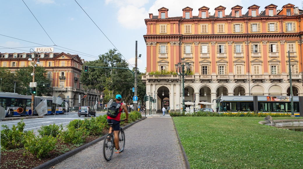 Piazza Statuto showing cycling as well as an individual male