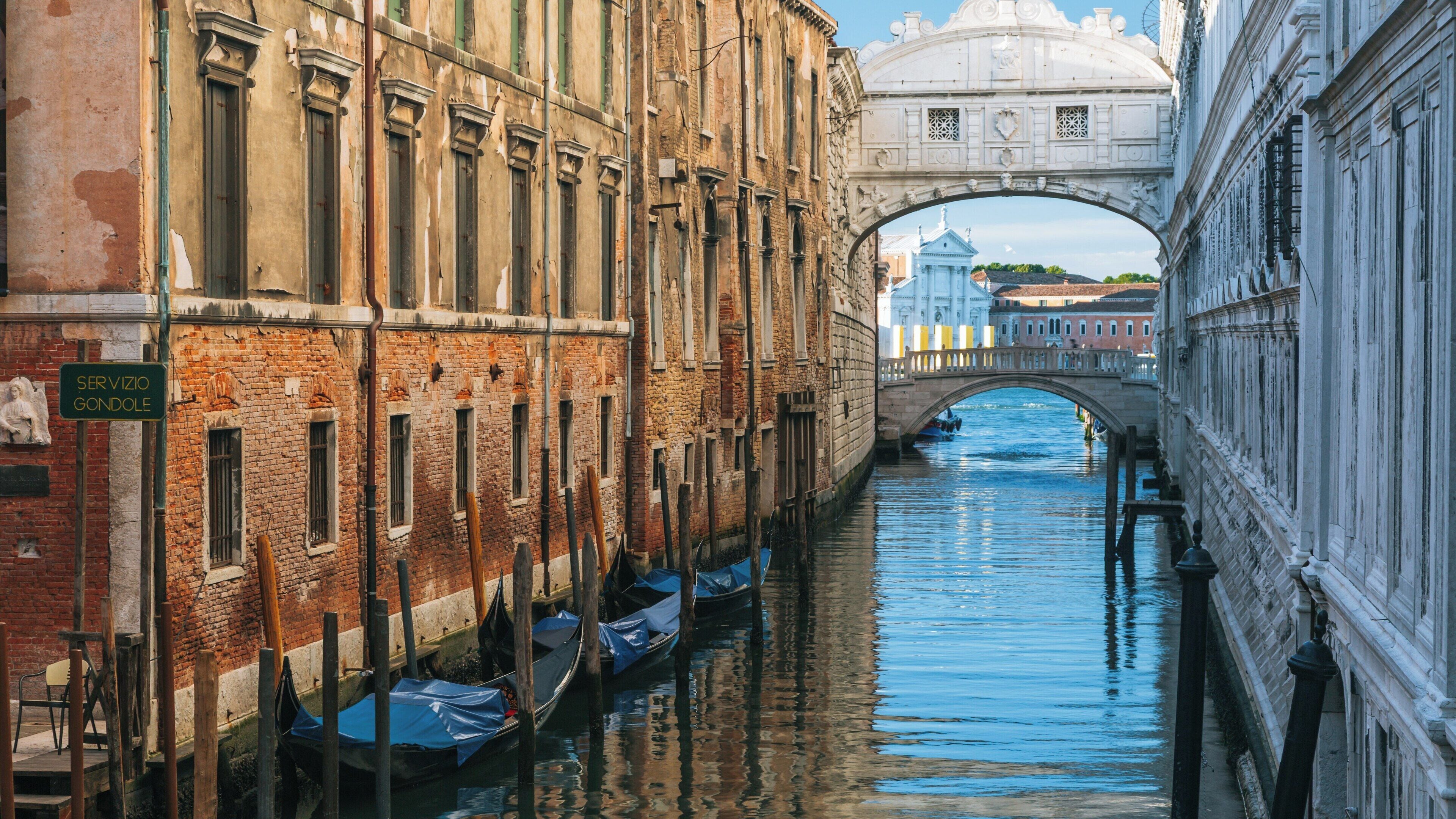 Exploring the stunning architecture of the Bridge of Sighs in the heart of Venice, a serene canal view reflecting the beauty of the city