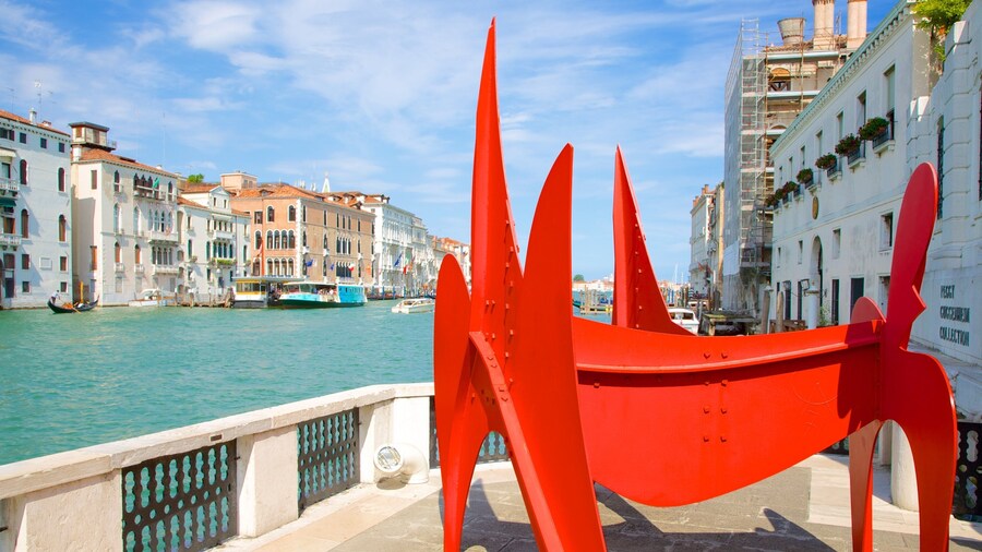 Peggy Guggenheim Museum showing outdoor art and a river or creek