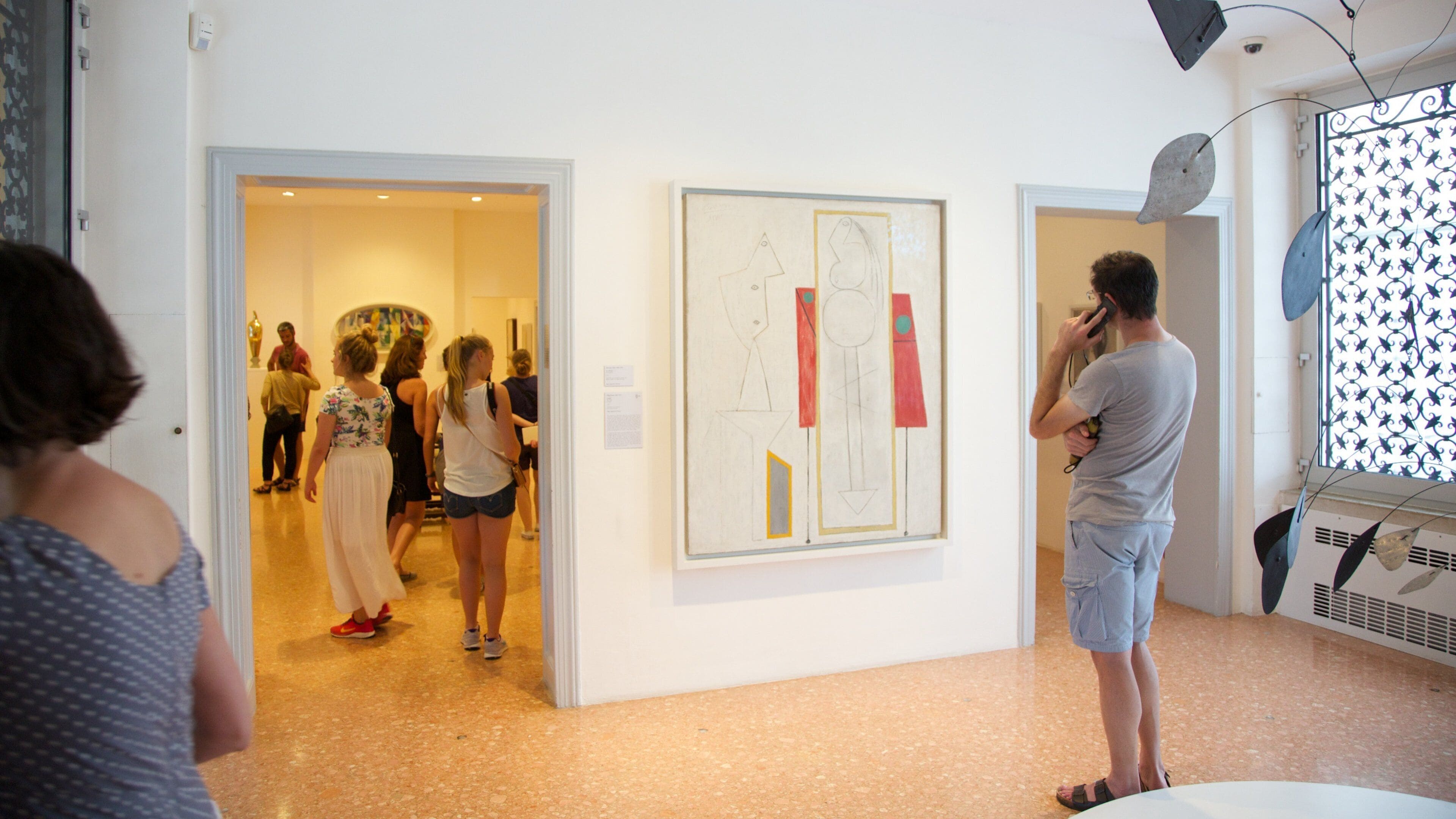 Peggy Guggenheim Museum featuring art and interior views as well as a small group of people
