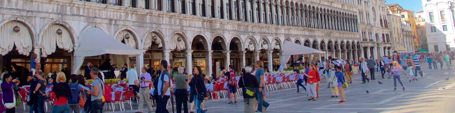 Procuratie Nuove featuring heritage architecture and a square or plaza as well as a large group of people