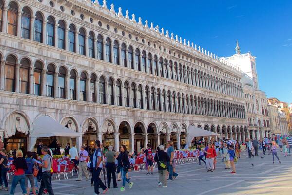 Procuratie Nuove featuring heritage architecture and a square or plaza as well as a large group of people