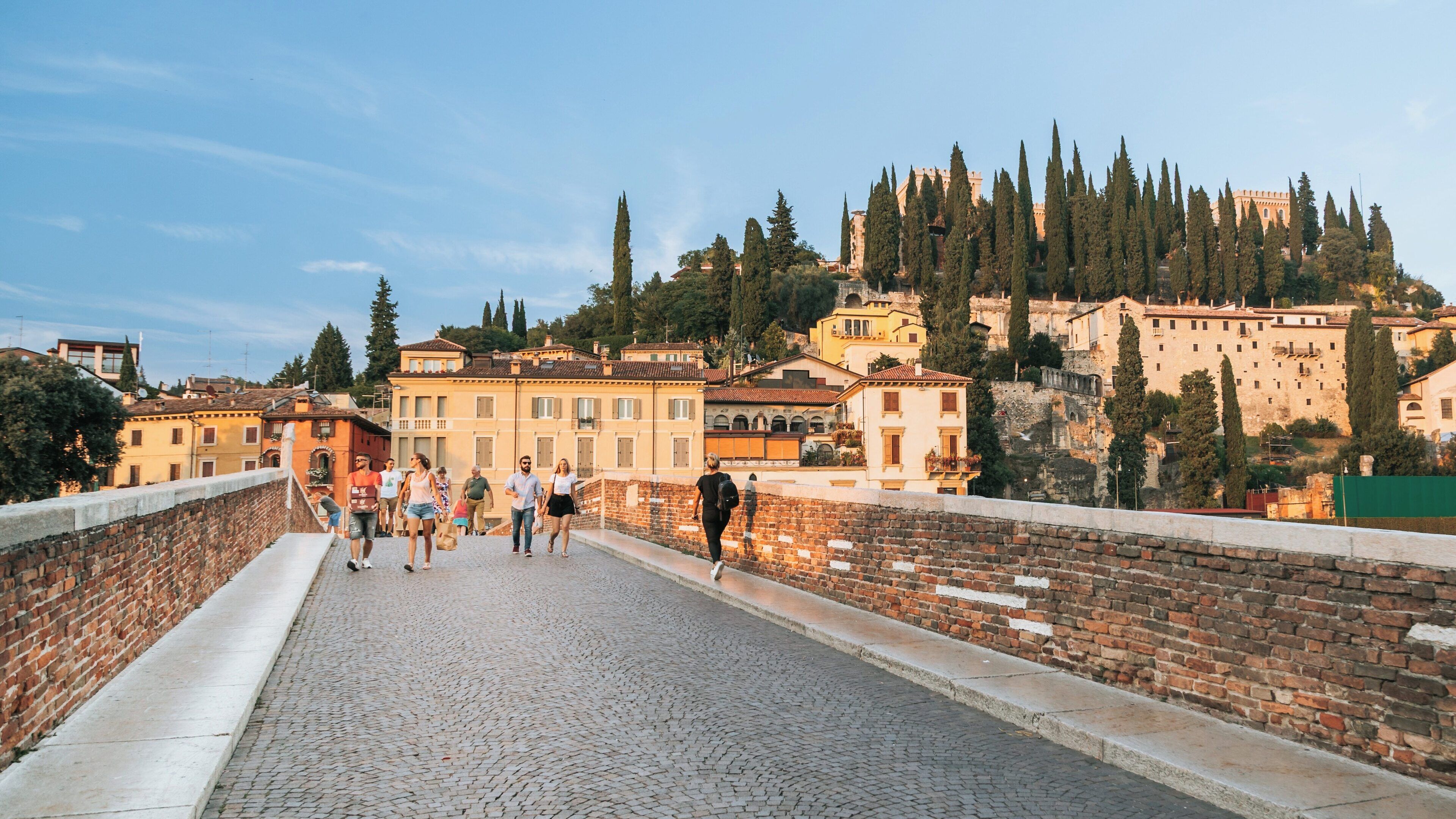 St. Peter's Castle stands majestically over the scenic landscape of Verona City Centre in Veneto, Italy during a warm sunset