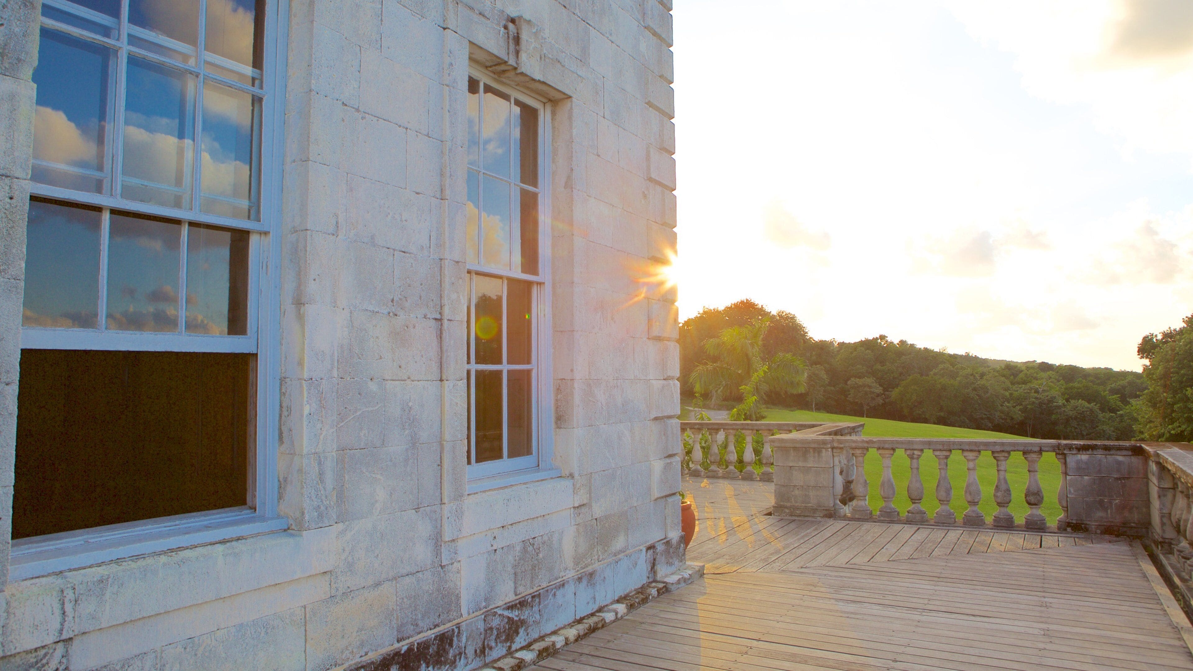 Rose Hall Great House featuring a house and a sunset