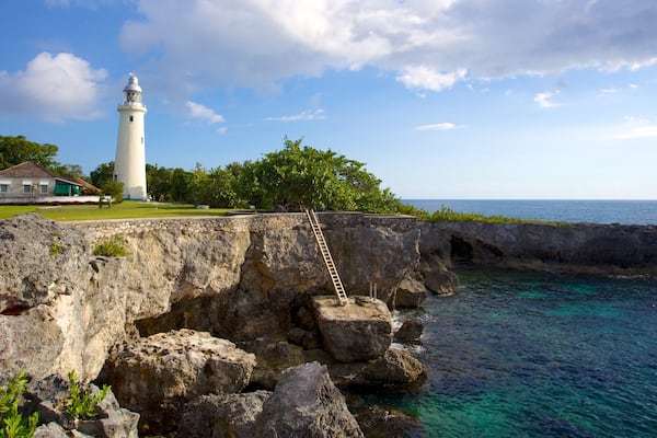 Negril Lighthouse featuring a lighthouse and rocky coastline