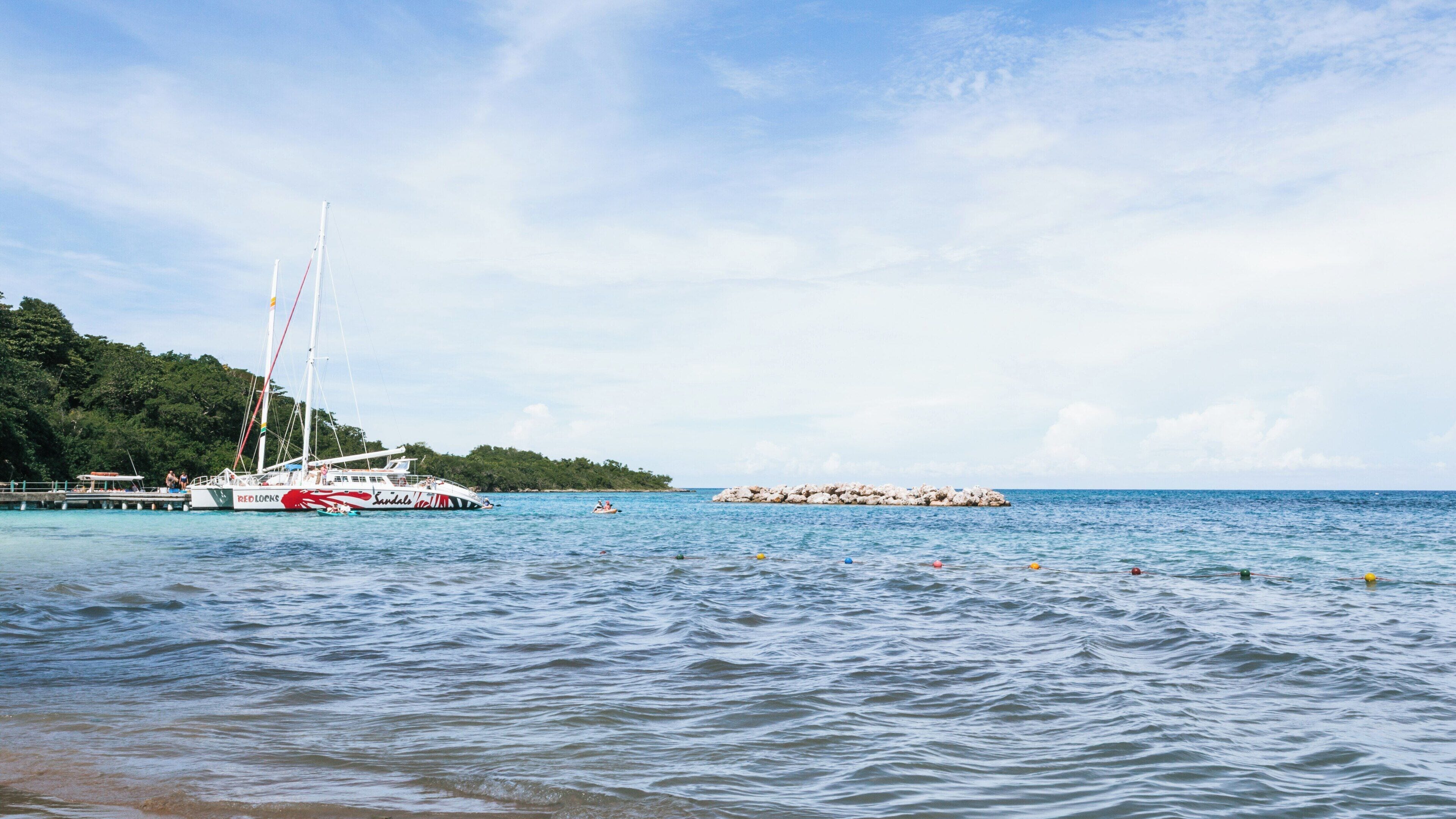 Exploring Dunn's River Falls and nearby coastal views in Ocho Rios, Jamaica during a sunny day
