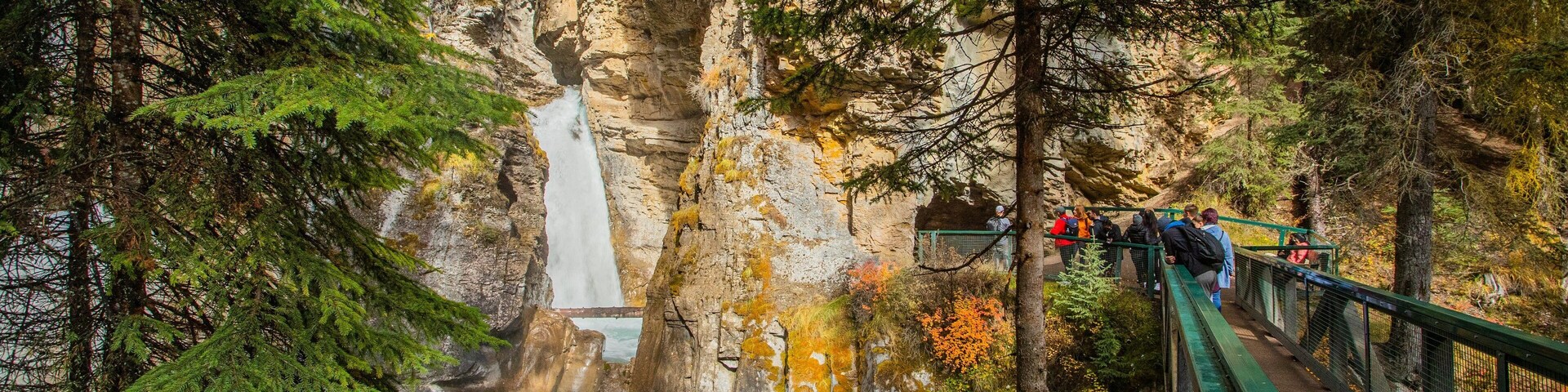 Johnston Canyon showing a gorge or canyon and a waterfall