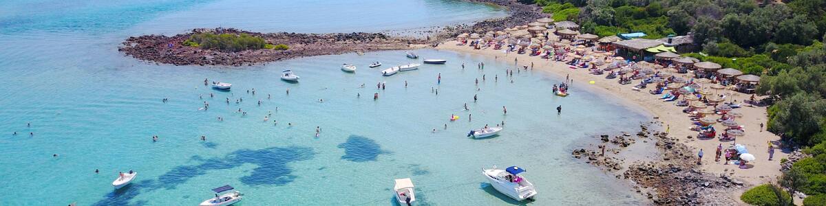 Aerial drone photo of Monolia island exotic beach with sapphire and turquoise clear waters, called the "Seychelles" of Greece, Lihadonisia island complex, North Evoia gulf, Greece