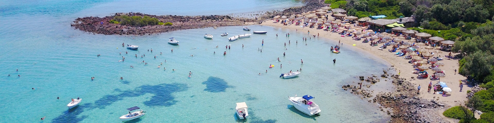 Aerial drone photo of Monolia island exotic beach with sapphire and turquoise clear waters, called the "Seychelles" of Greece, Lihadonisia island complex, North Evoia gulf, Greece