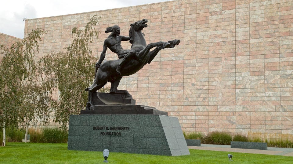 Joslyn Art Museum which includes a garden and a statue or sculpture