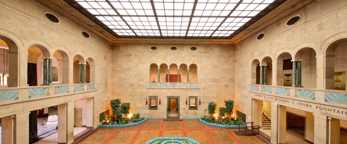 Joslyn Art Museum featuring a fountain, heritage elements and interior views