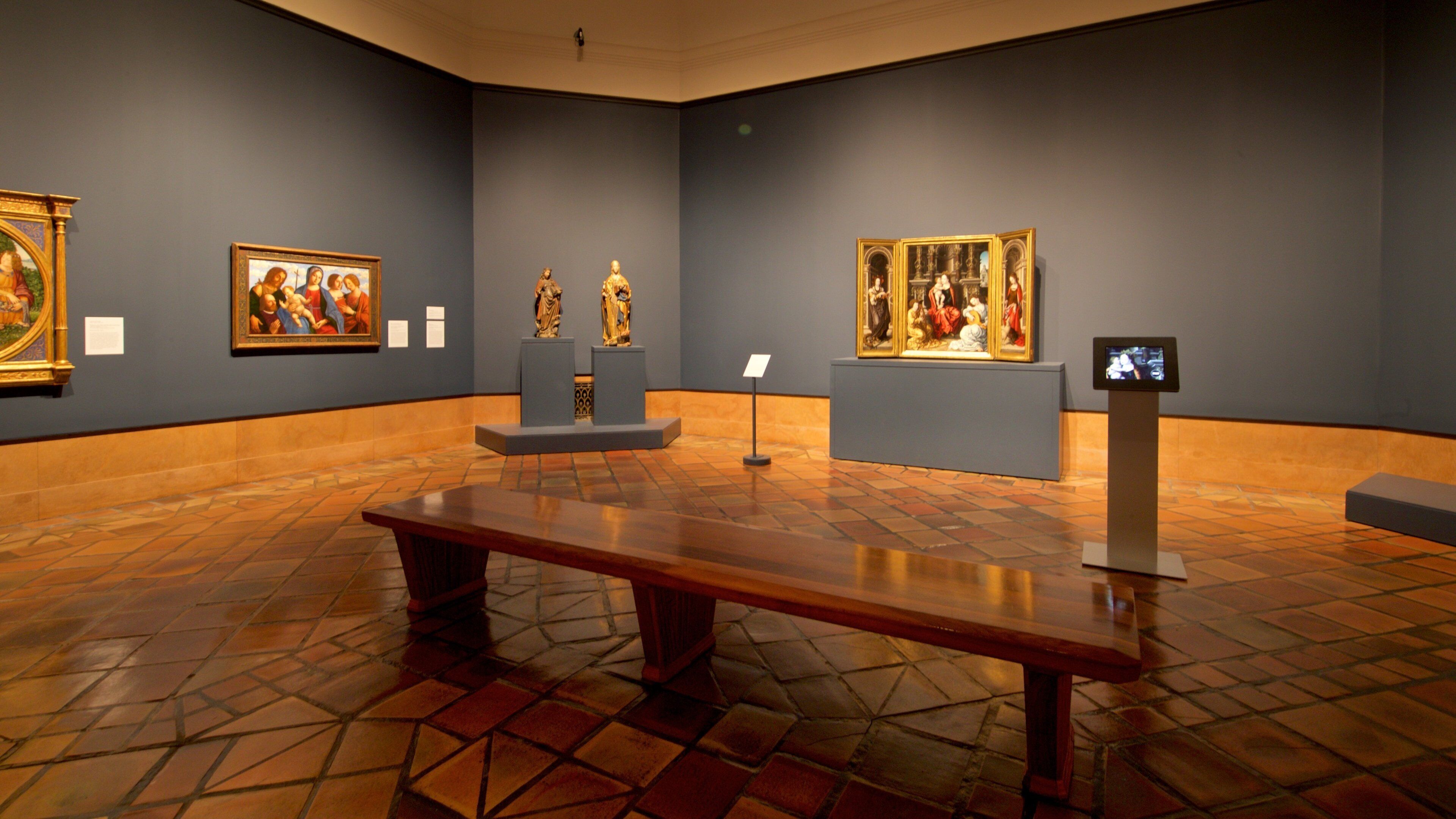 An art gallery with paintings and sculptures on display.