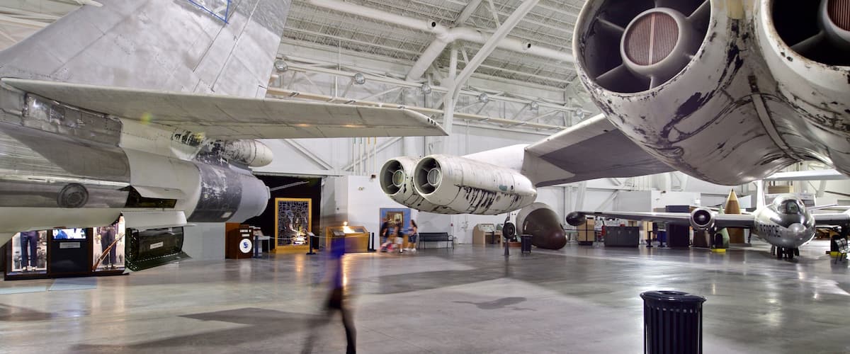 A large aircraft with visible wear and tear, including a damaged wing and engine.