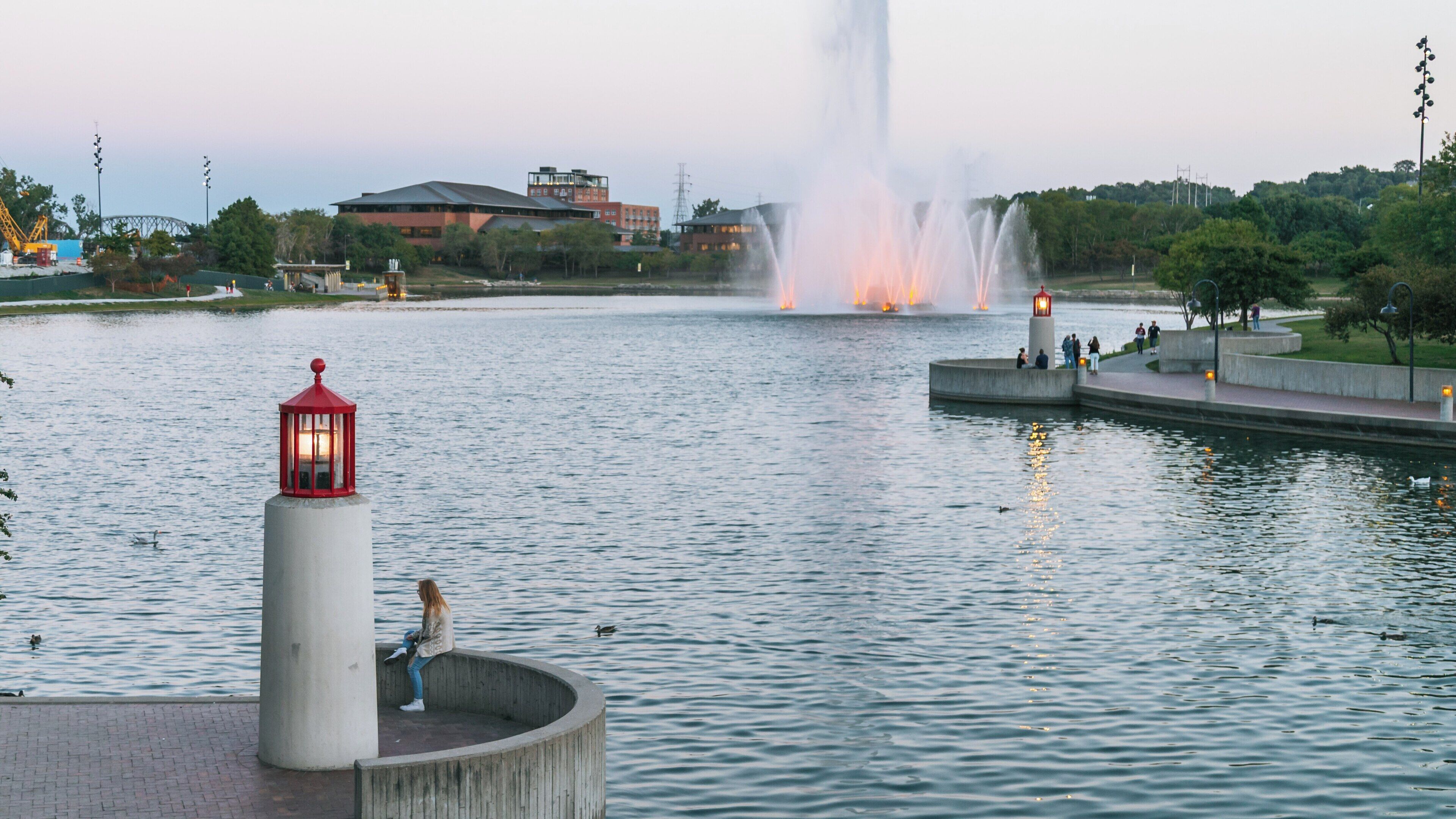 Relaxing evening at Heartland of America Park with fountain display and waterfront stroll in downtown Omaha, Nebraska