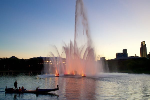Heartland of America Park featuring a sunset, a fountain and a lake or waterhole