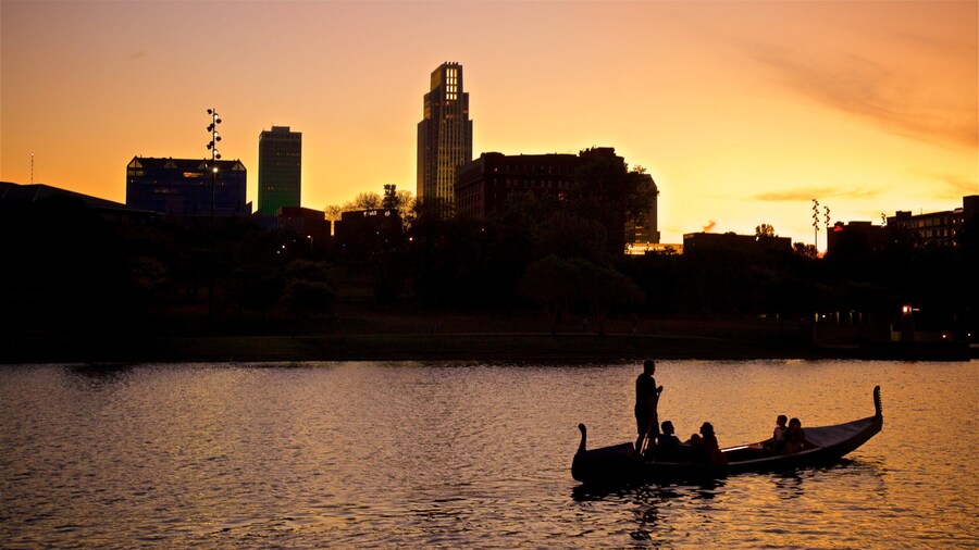 Heartland of America Park showing a sunset, skyline and kayaking or canoeing