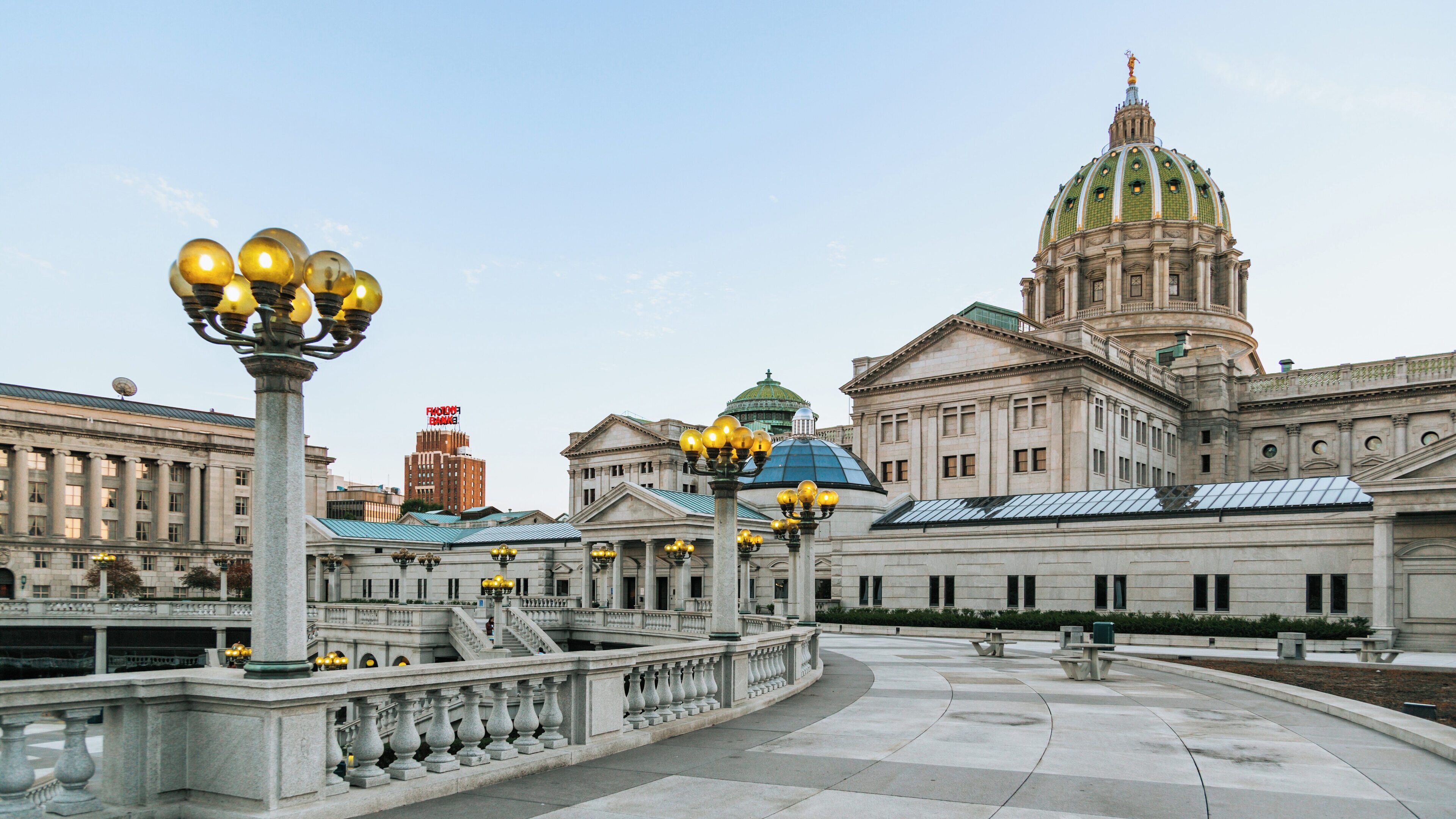 Detailed view of Pennsylvania State Capitol complex in Harrisburg showcasing its grand architecture and beautiful exterior lighting at dusk