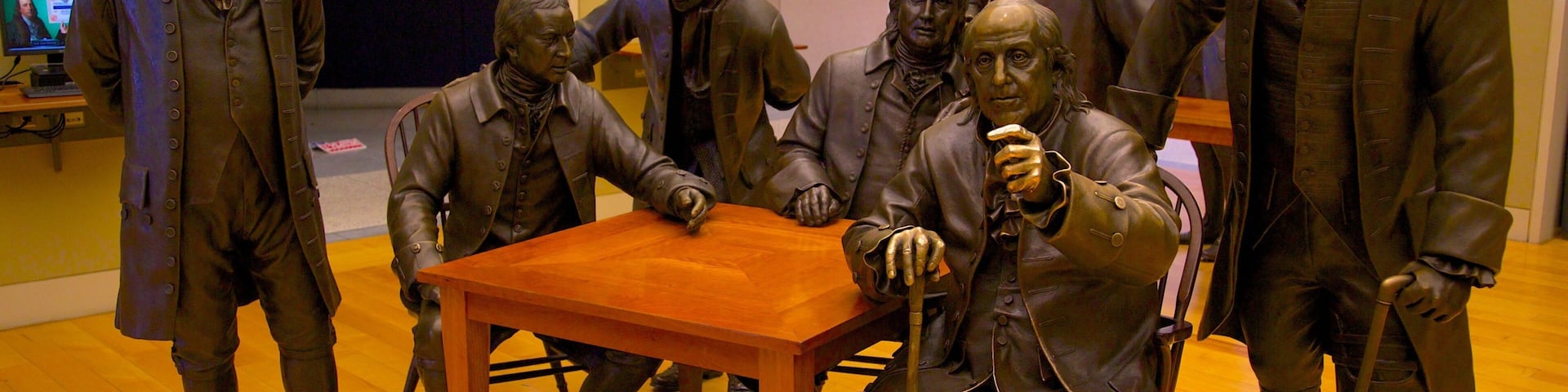 Statues of founding fathers discussing the Constitution at National Constitution Center in Philadelphia