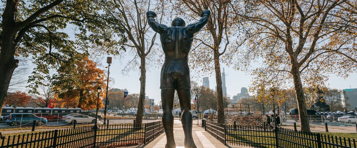 Rocky Statue showing a park and a statue or sculpture