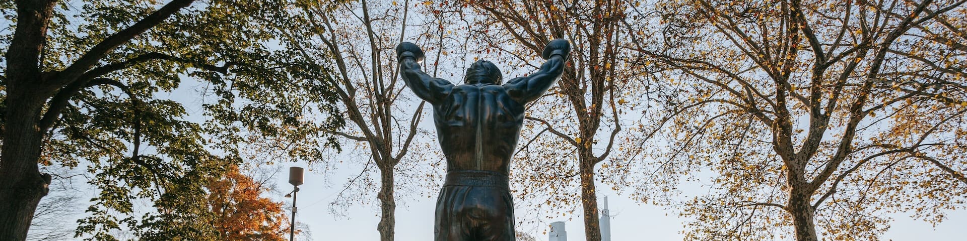 Rocky Statue showing a park and a statue or sculpture
