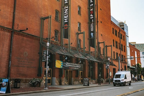 A historic building with a large sign for Heinz History Center.