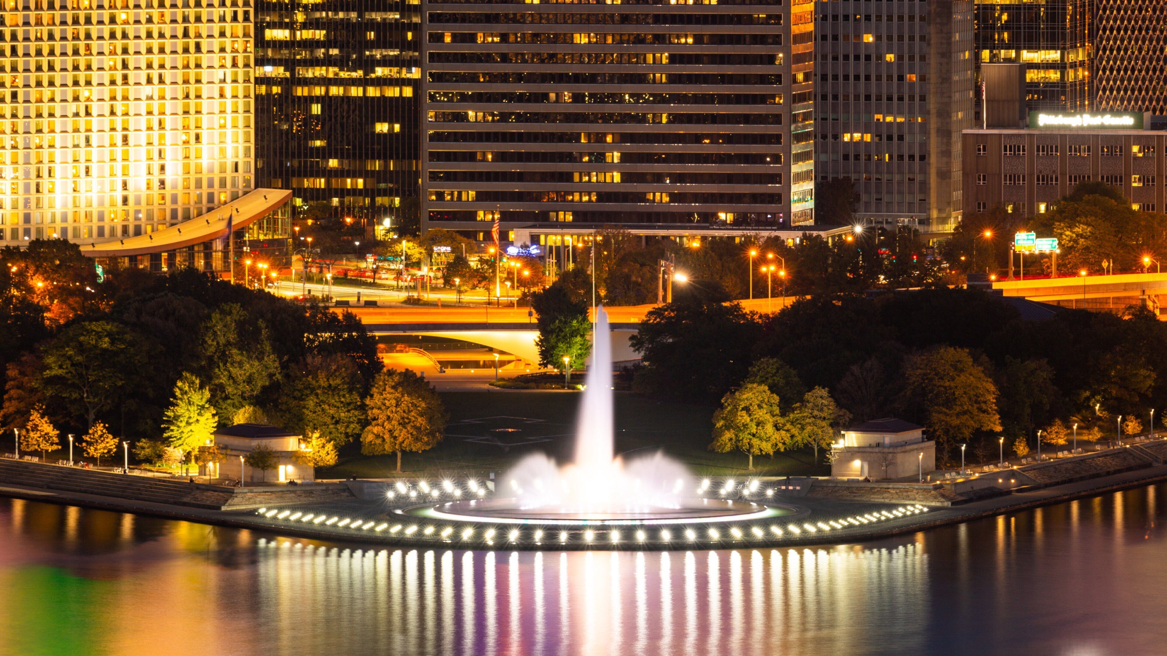 Point State Park which includes a fountain, night scenes and a city