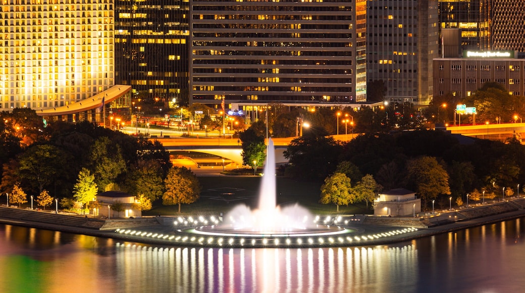 Point State Park which includes a fountain, night scenes and a city