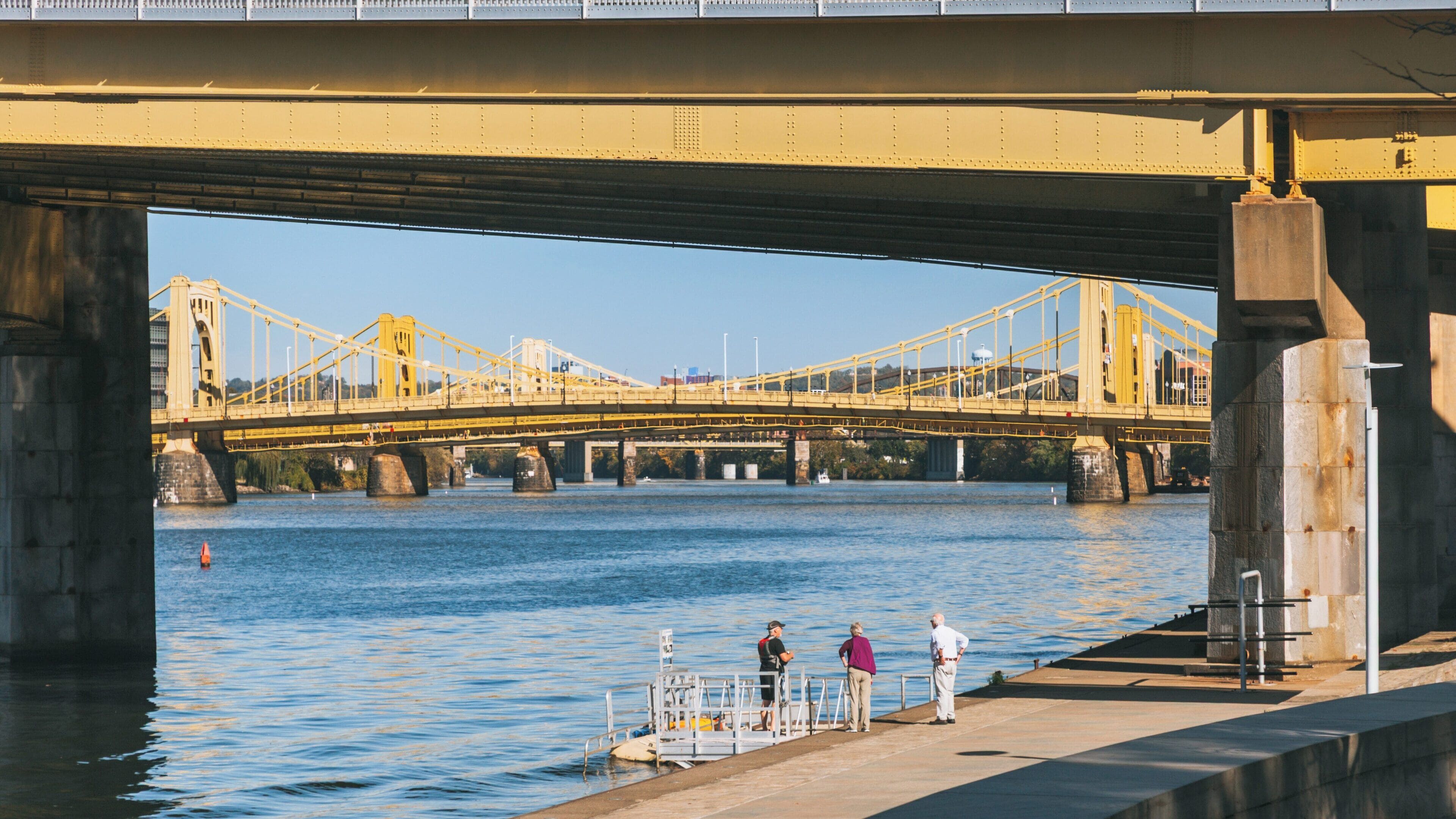 Visitors enjoy a sunny day near the bridges at Point State Park in Downtown Pittsburgh, Pennsylvania