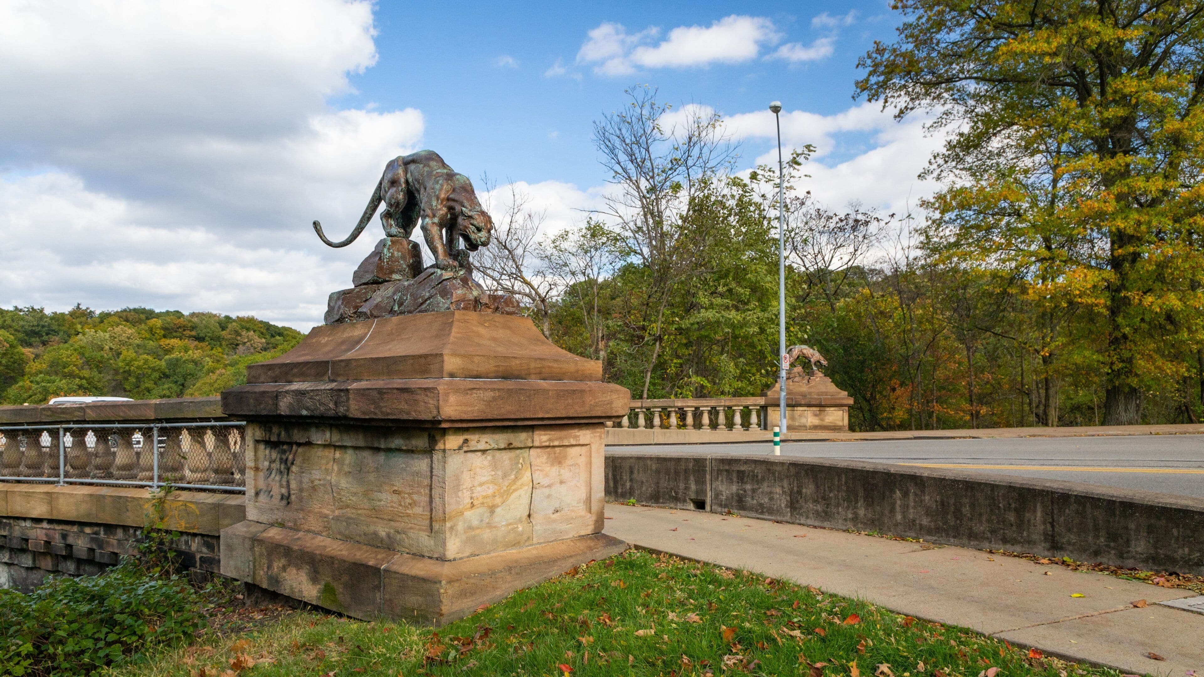 Schenley Park featuring a statue or sculpture and a bridge