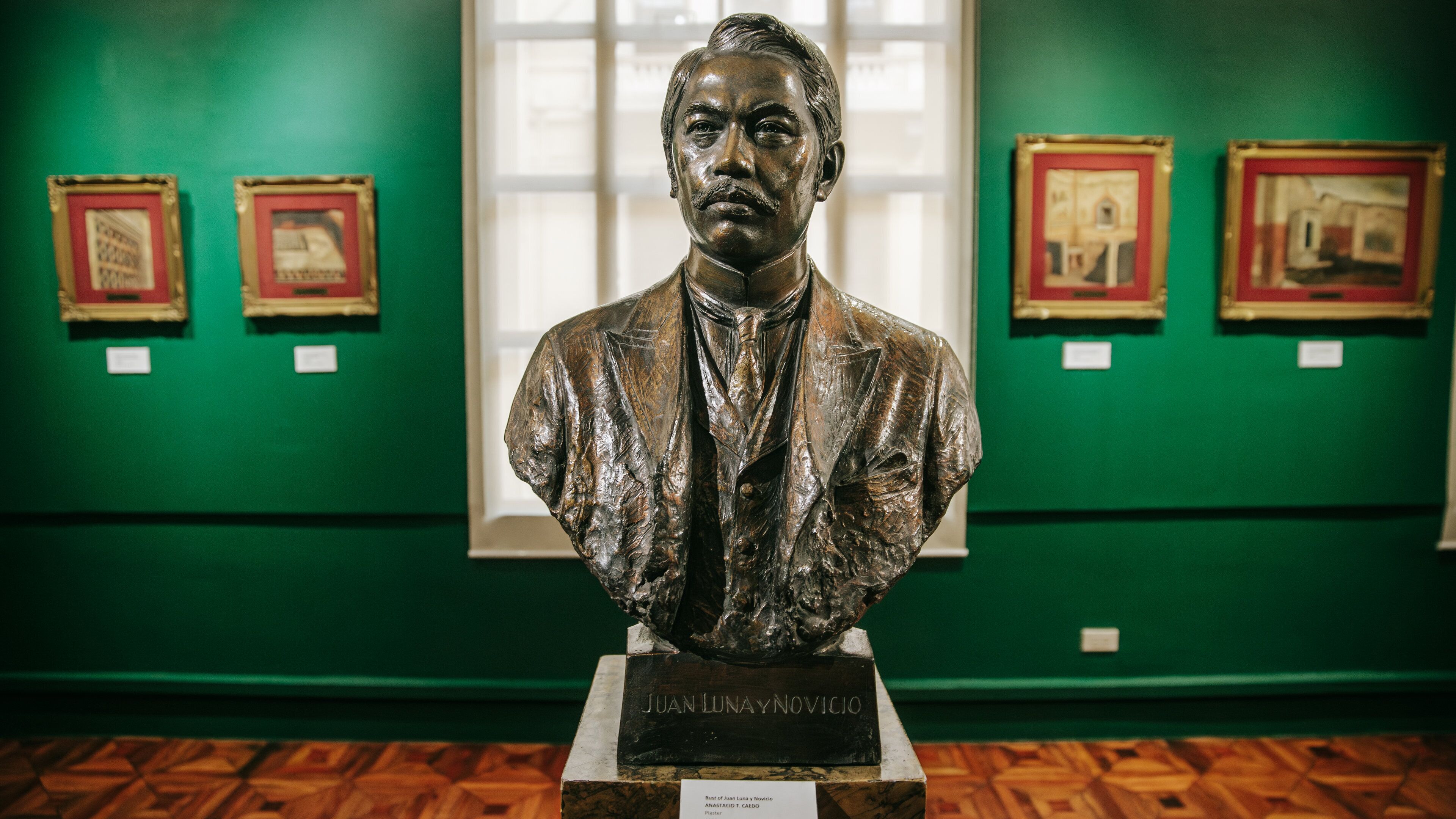 National Museum of the Filipino People which includes interior views and a statue or sculpture