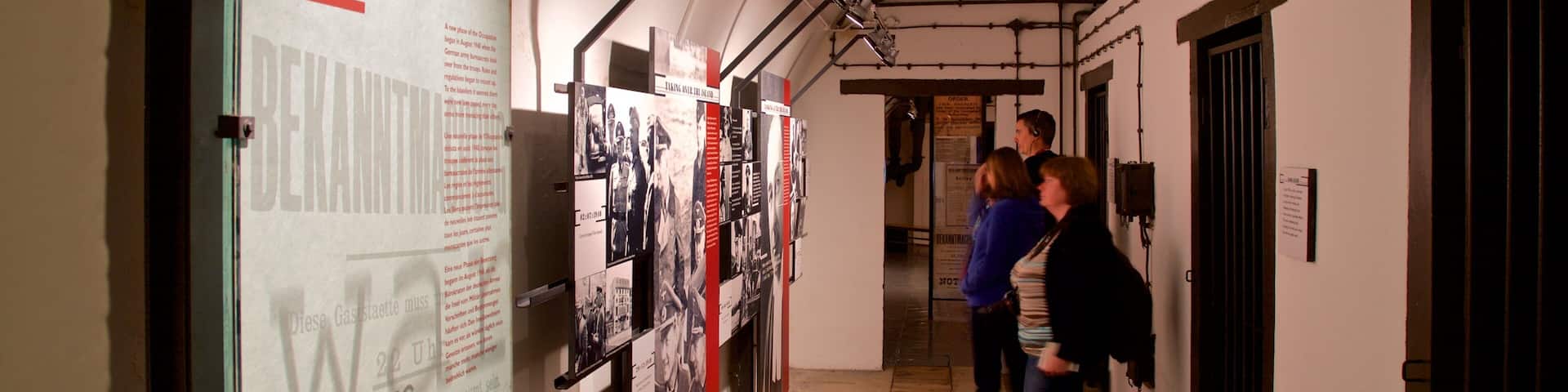 Jersey War Tunnels - German Underground Hospital featuring interior views as well as a small group of people