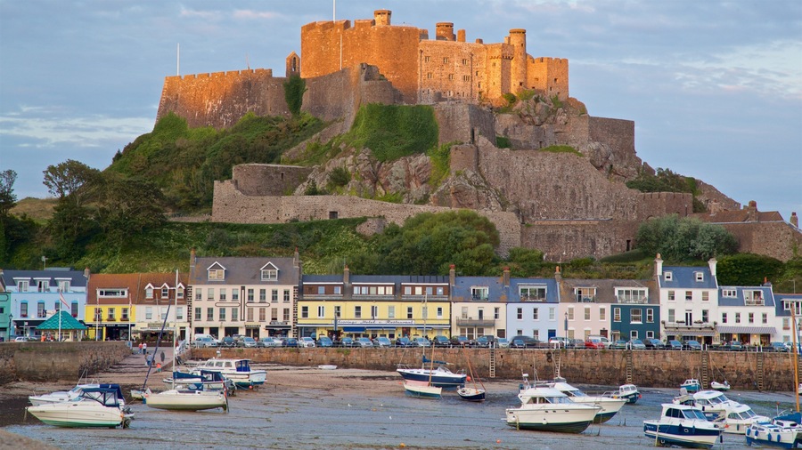 Mont Orgueil Castle showing a bay or harbour, a castle and a coastal town