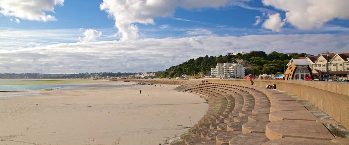 St. Helier Beach showing general coastal views, a coastal town and a sandy beach