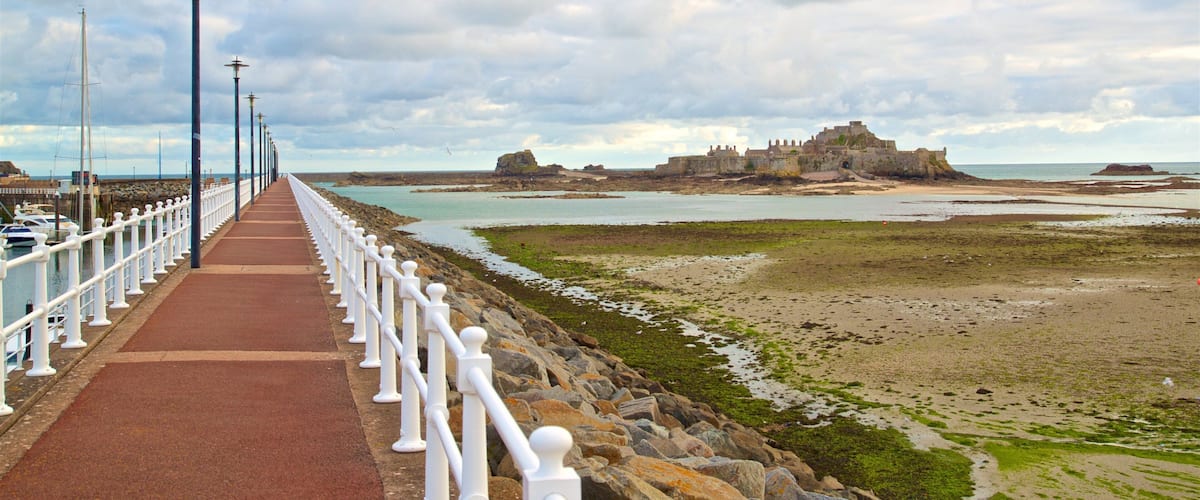 St. Helier Beach showing chateau or palace and general coastal views