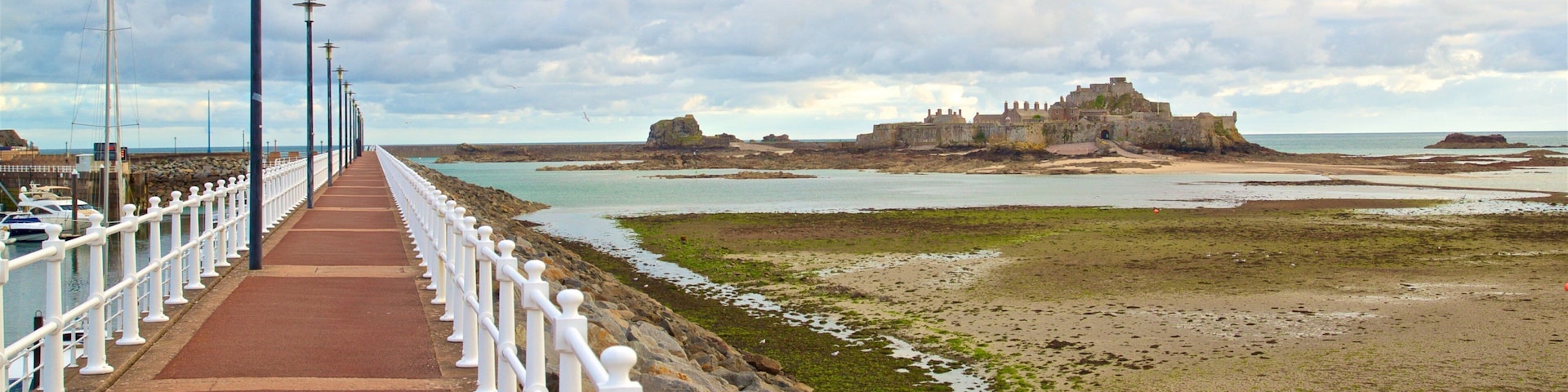 St. Helier Beach showing chateau or palace and general coastal views