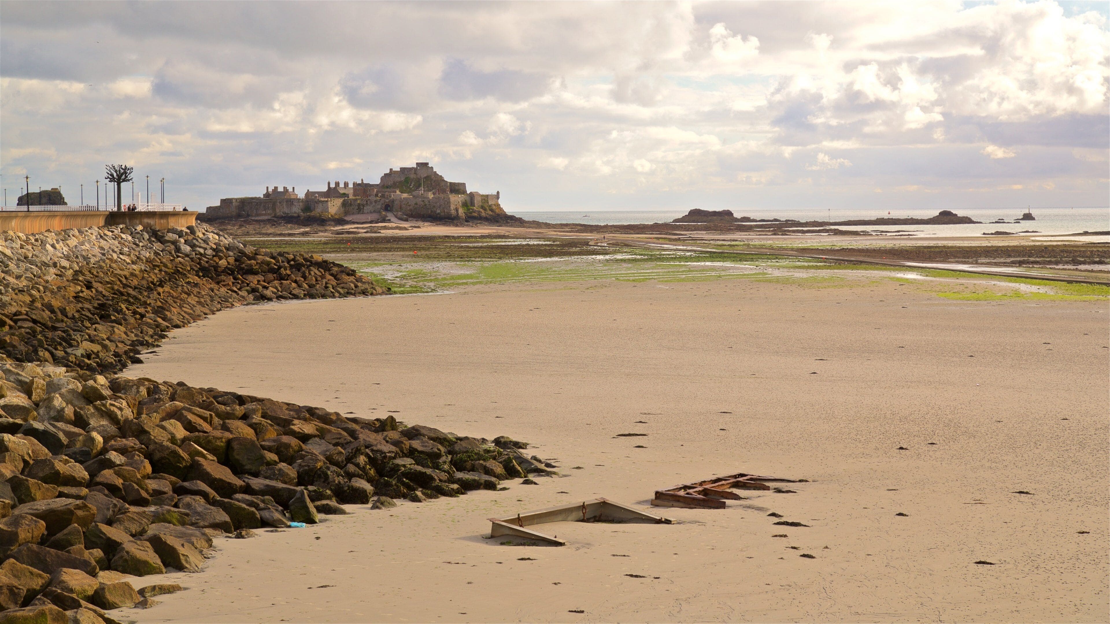 St. Helier Beach featuring a sandy beach and general coastal views