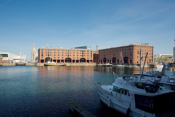 Albert Dock which includes a bay or harbour and heritage architecture