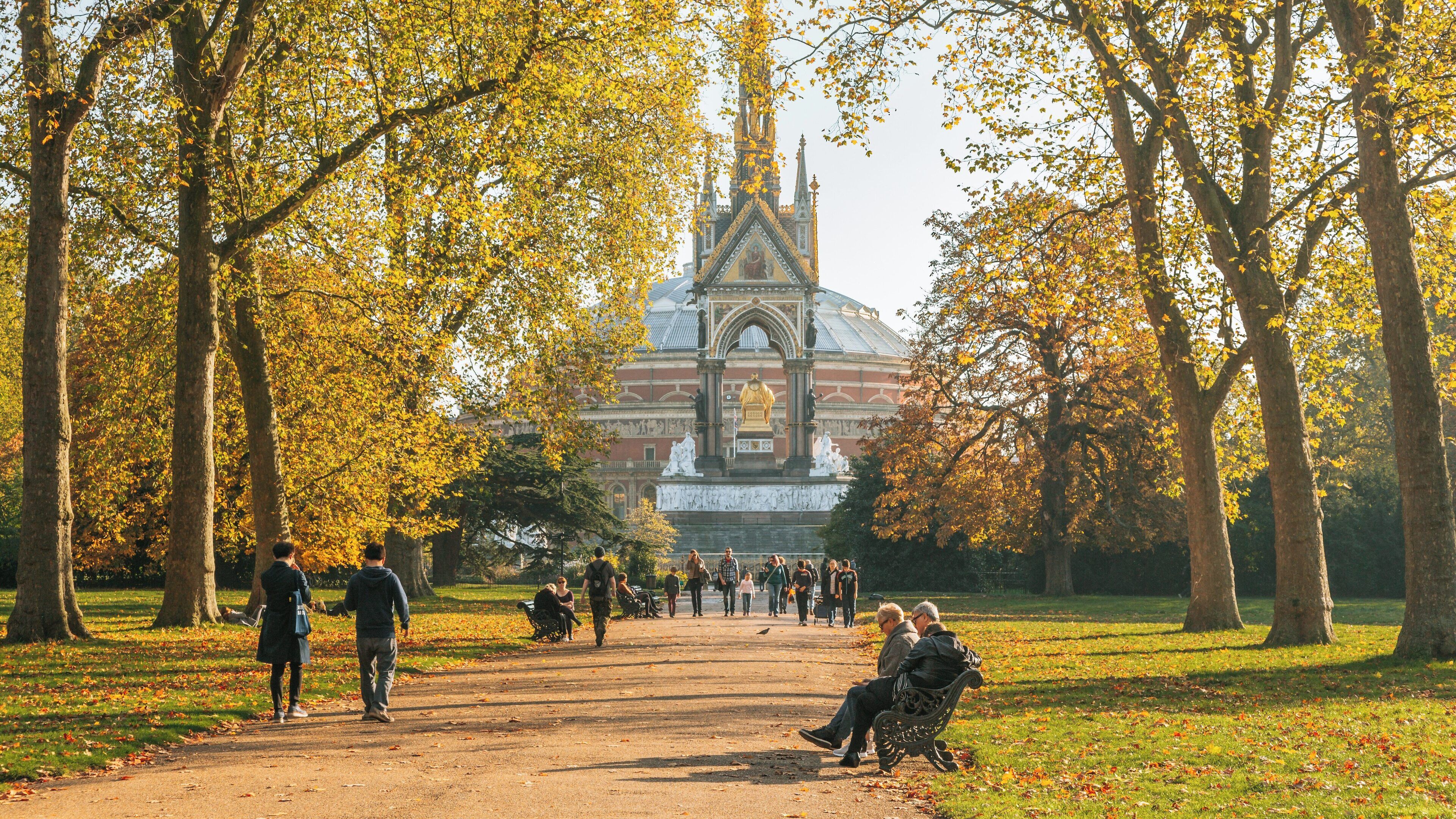 Autumn walk by the Albert Memorial in Westminster, London with visitors enjoying the scenery and historic architecture in a picturesque park setting