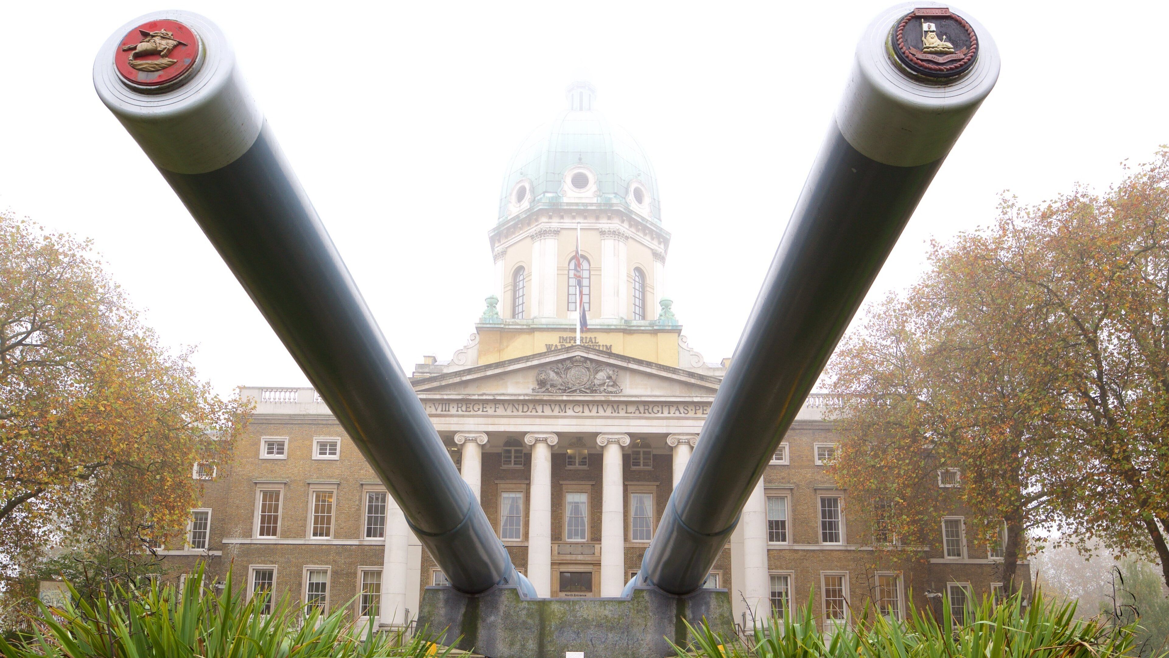 Imperial War Museum featuring heritage architecture, military items and mist or fog
