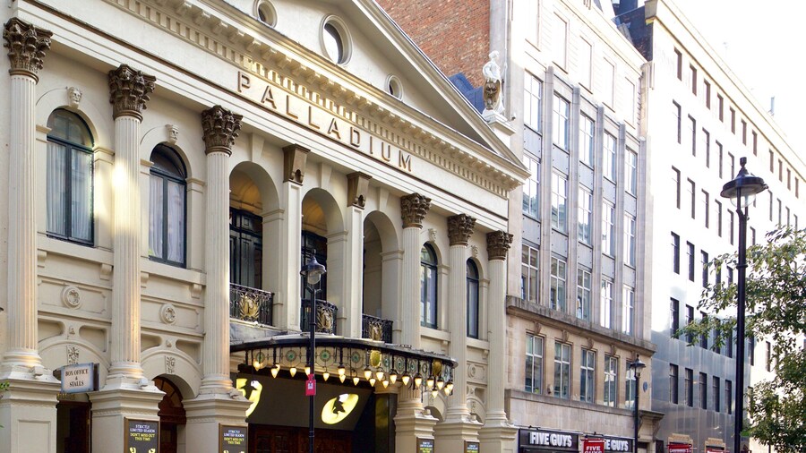 London Palladium Theatre featuring signage, heritage architecture and theatre scenes