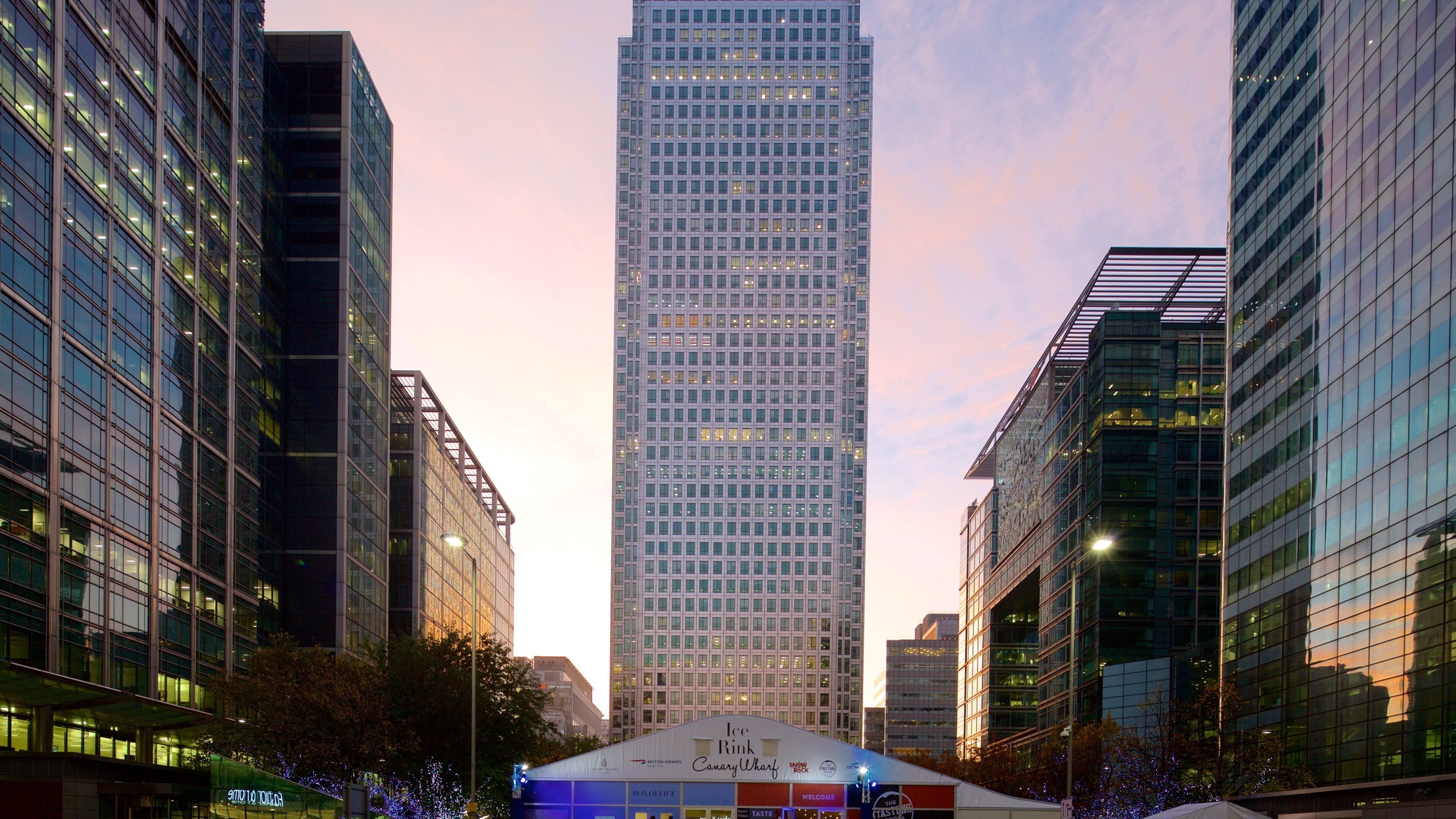 One Canada Square featuring a city, a high-rise building and a sunset